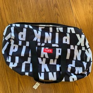 NWT Pink duffel bag. Measures 21”L x 11” H. Brand new
